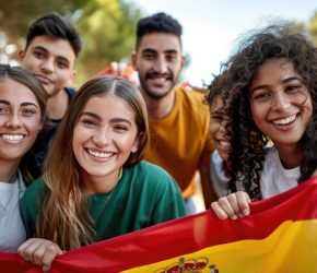 Group of friends celebrating with the Spanish flag.