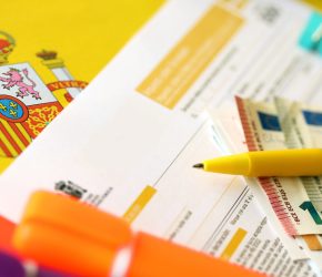 Modelo 200 spanish tax form for corporate income tax for non resident taxpayer lies on flag of Spain close up on accountant table