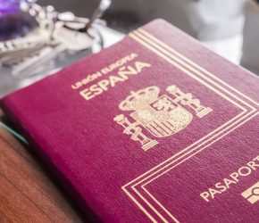 spanish-passport-next-to-keys-and-clock-on-a-table-2026-01-11-10-04-03-utc